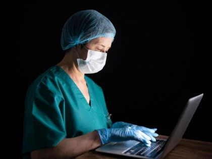 doctor with laptop and mask